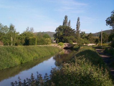 Scenic view of a river with lush greenery and trees in Compton Bishop, Somerset.